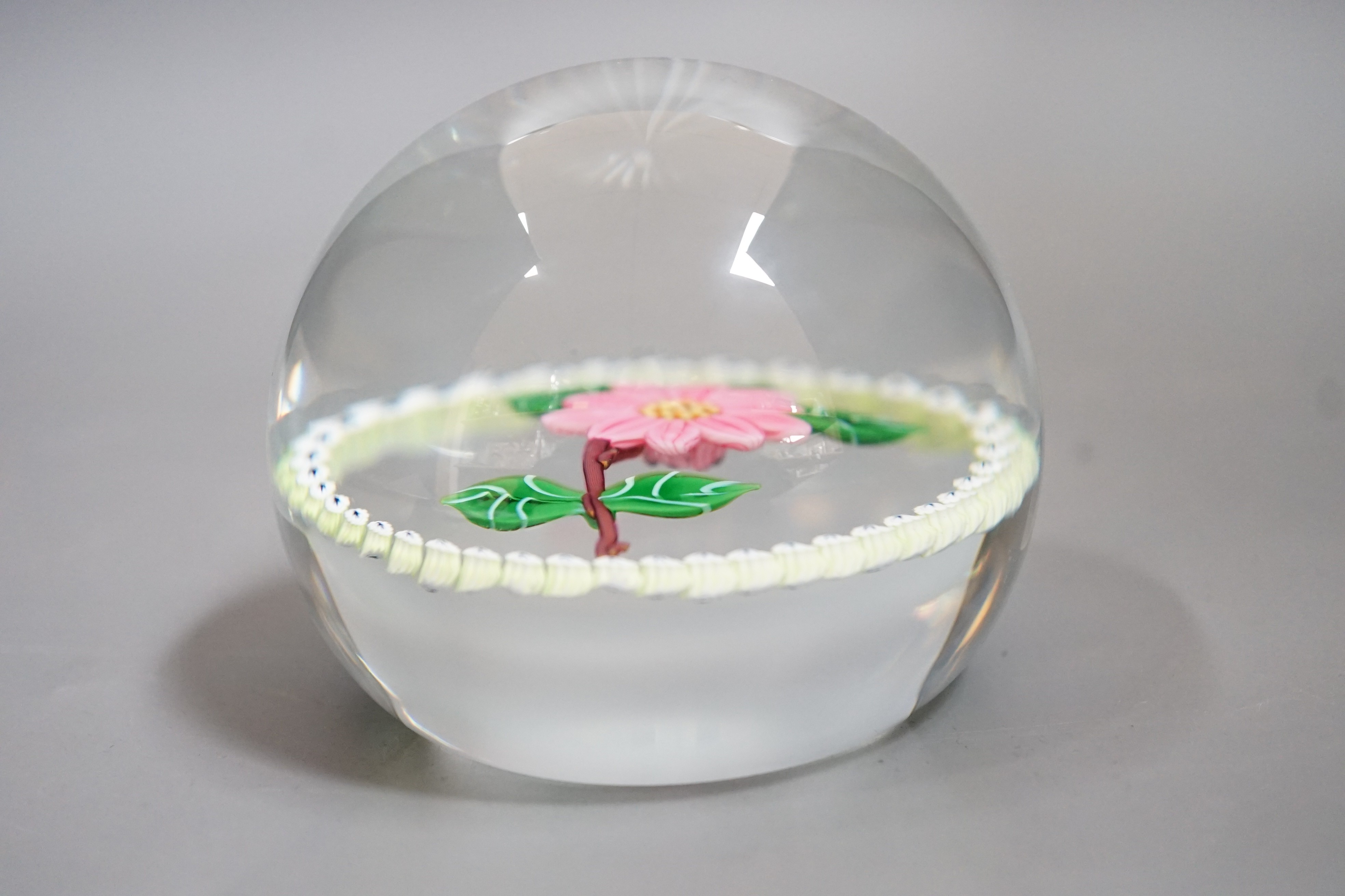 A Caithness pink camelia glass paperweight, no.94/250